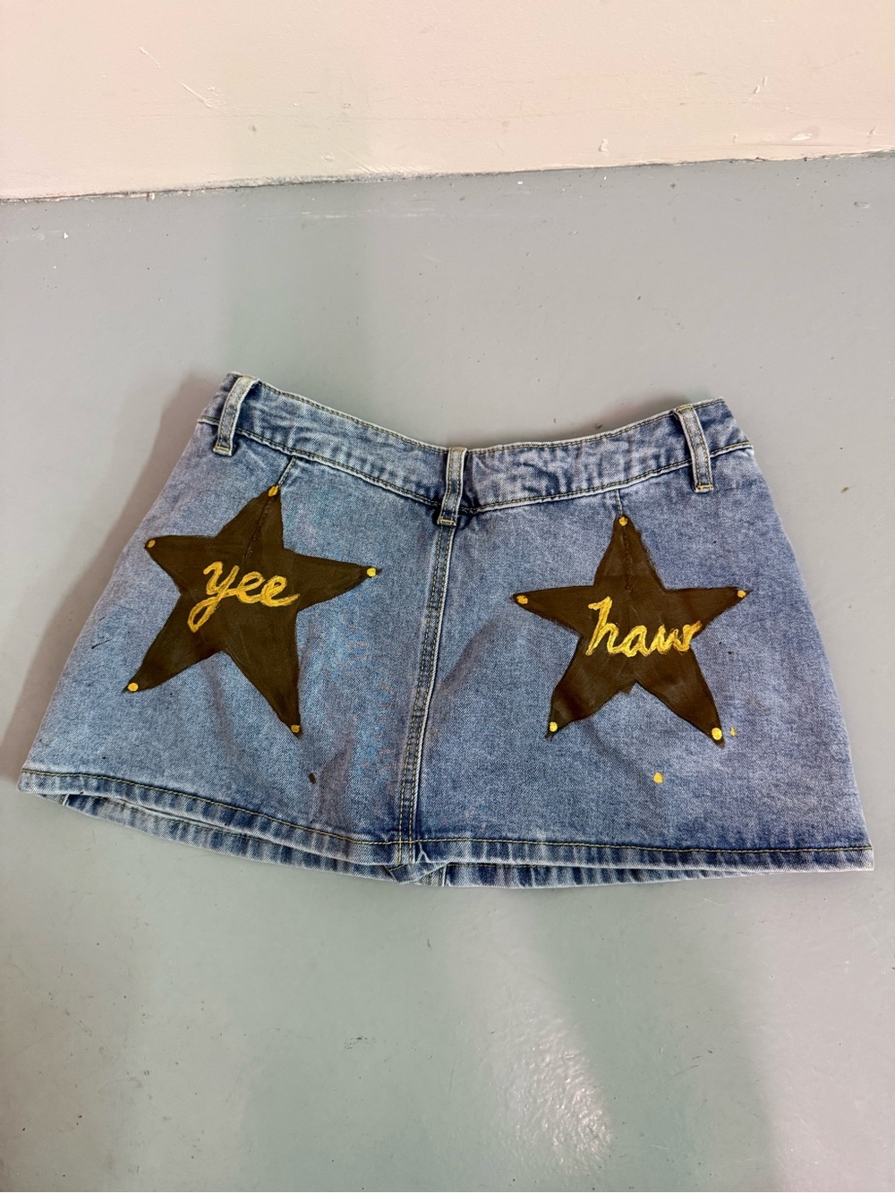 Hand painted “yee haw” denim mini skirt with built in shorts